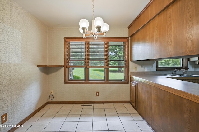 5694 Spurgeon Rd, Joplin, MO 64804 - unfurnished dining area featuring a chandelier and light tile patterned floors