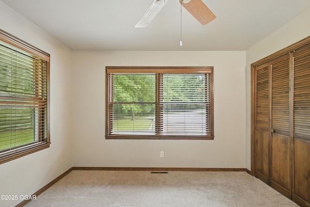 5694 Spurgeon Rd, Joplin, MO 64804 - unfurnished bedroom featuring carpet floors, a closet, and ceiling fan