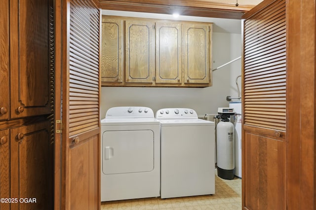 5694 Spurgeon Rd, Joplin, MO 64804 - washroom with separate washer and dryer, cabinet space, and light flooring