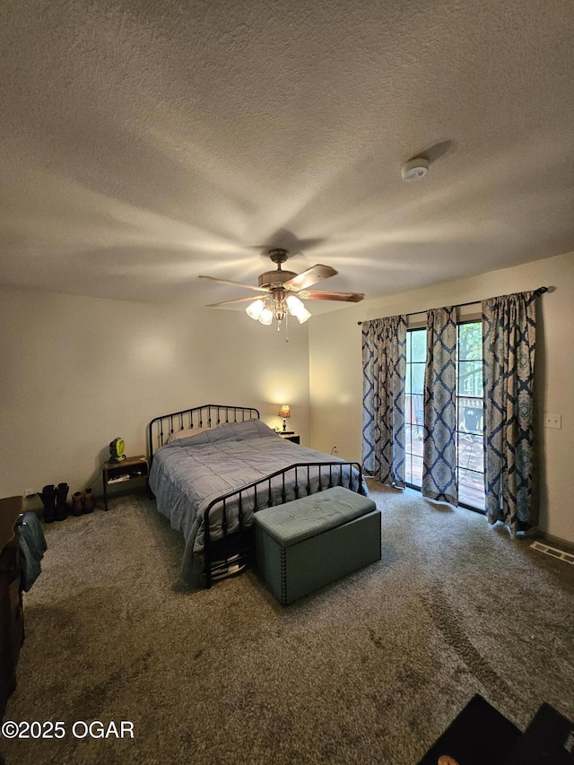 5358 Lawrence Unit 2220, Pierce City, MO 65723 - carpeted bedroom featuring access to exterior, a textured ceiling, and ceiling fan