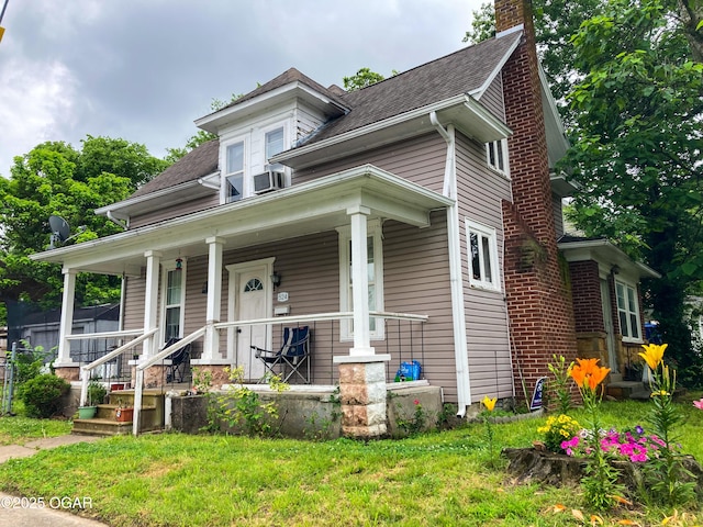 524 W 2nd St, Webb City, MO 64870 - american foursquare style home featuring a chimney, covered porch, roof with shingles, and a front lawn