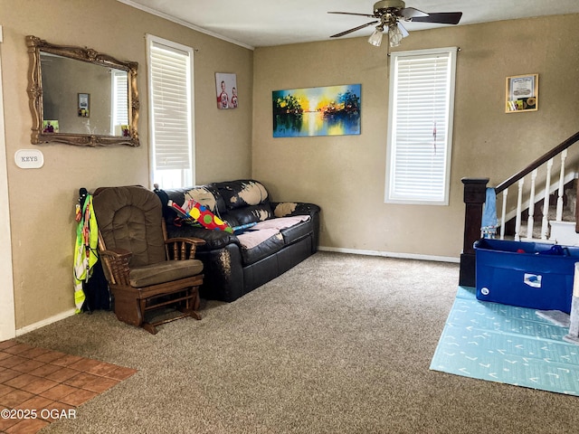 524 W 2nd St, Webb City, MO 64870 - carpeted living room with ceiling fan, stairs, and crown molding