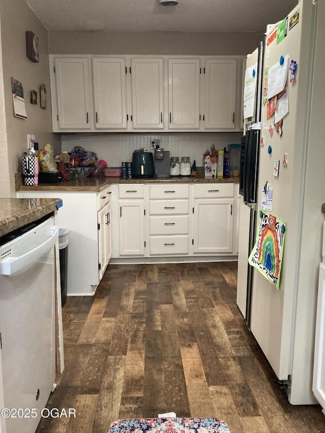 524 W 2nd St, Webb City, MO 64870 - kitchen featuring white appliances, white cabinetry, and dark countertops