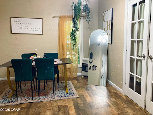 524 W 2nd St, Webb City, MO 64870 - dining room with wood finished floors and heating unit
