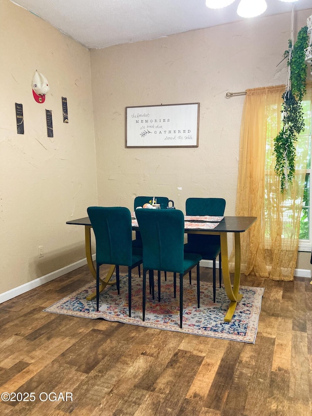 524 W 2nd St, Webb City, MO 64870 - dining space featuring hardwood / wood-style floors and baseboards
