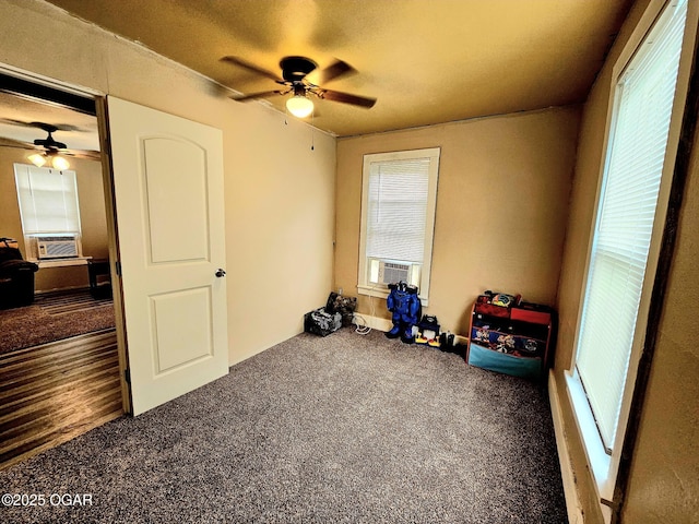 1109 Lincoln Ave, Baxter Springs, KS 66713 - unfurnished bedroom featuring multiple windows, carpet, cooling unit, and a ceiling fan