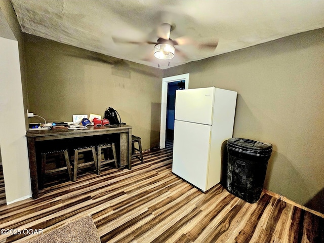1109 Lincoln Ave, Baxter Springs, KS 66713 - misc room with wood finished floors, a ceiling fan, and a desk