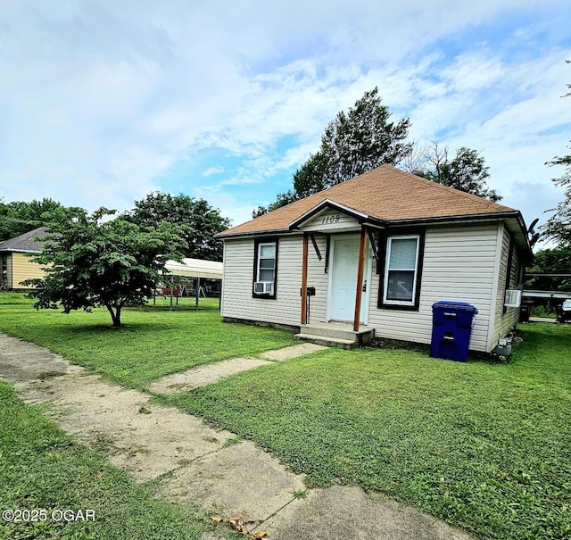 1109 Lincoln Ave, Baxter Springs, KS 66713 - view of front of home featuring a front yard