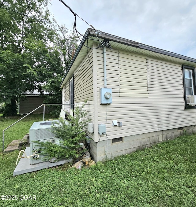 1109 Lincoln Ave, Baxter Springs, KS 66713 - view of home's exterior featuring crawl space and a yard