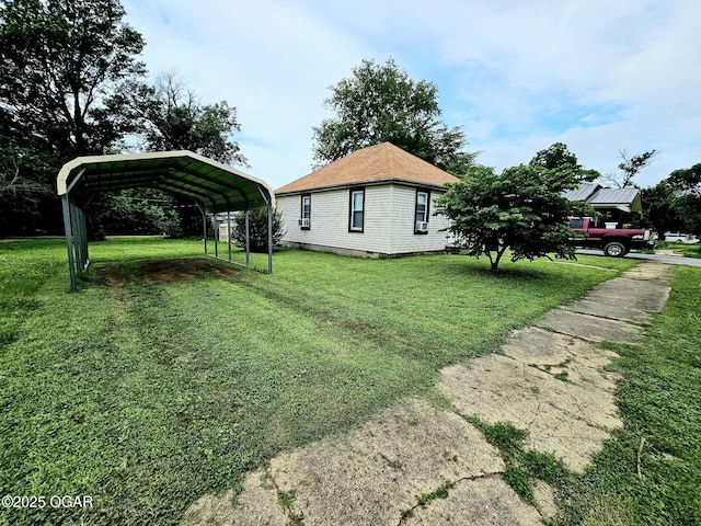 1109 Lincoln Ave, Baxter Springs, KS 66713 - view of home's exterior with a carport, a yard, and driveway