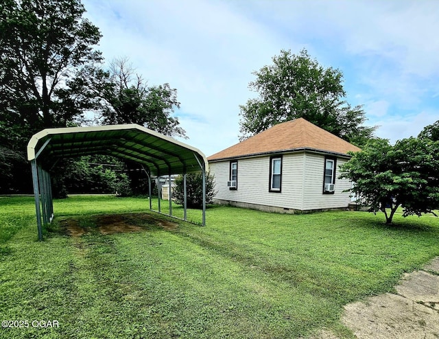 1109 Lincoln Ave, Baxter Springs, KS 66713 - view of side of home with driveway, a lawn, a detached carport, and crawl space