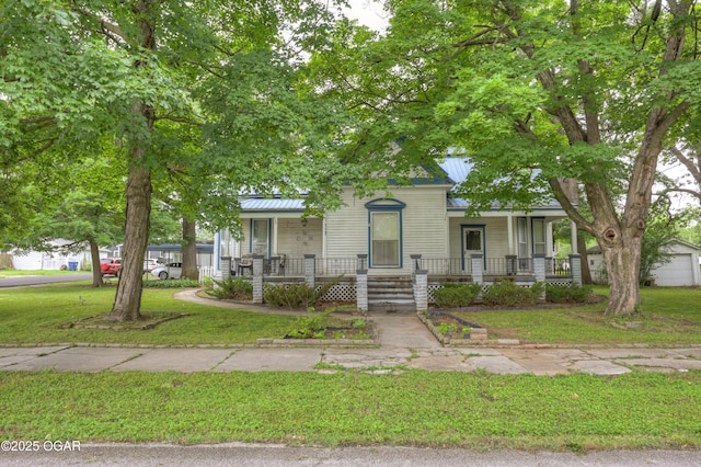 117 S 11th St, Sarcoxie, MO 64862 - view of front facade with a front yard and covered porch