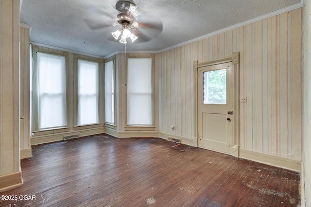 117 S 11th St, Sarcoxie, MO 64862 - empty room with hardwood / wood-style flooring, crown molding, ceiling fan, and a textured ceiling