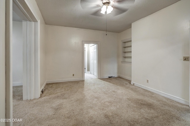 117 S 11th St, Sarcoxie, MO 64862 - spare room featuring carpet floors, a textured ceiling, and a ceiling fan
