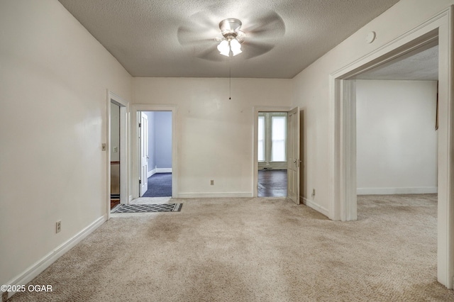 117 S 11th St, Sarcoxie, MO 64862 - carpeted empty room with a textured ceiling and a ceiling fan