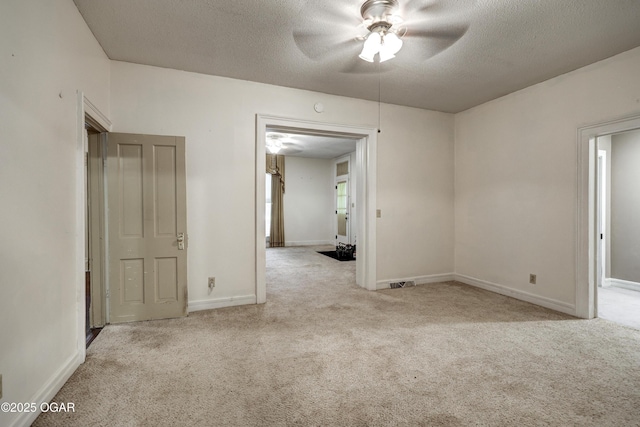 117 S 11th St, Sarcoxie, MO 64862 - unfurnished room featuring carpet, a ceiling fan, and a textured ceiling