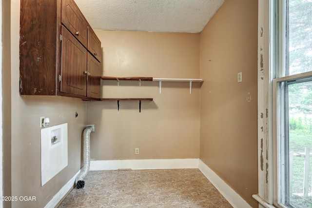 117 S 11th St, Sarcoxie, MO 64862 - laundry room featuring hookup for an electric dryer, hookup for a washing machine, a textured ceiling, and cabinet space