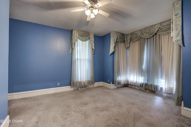 117 S 11th St, Sarcoxie, MO 64862 - carpeted spare room with a textured ceiling and a ceiling fan