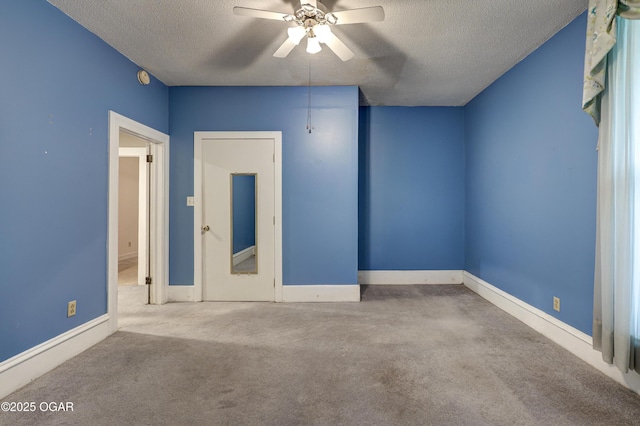 117 S 11th St, Sarcoxie, MO 64862 - unfurnished bedroom with a textured ceiling, carpet floors, and ceiling fan