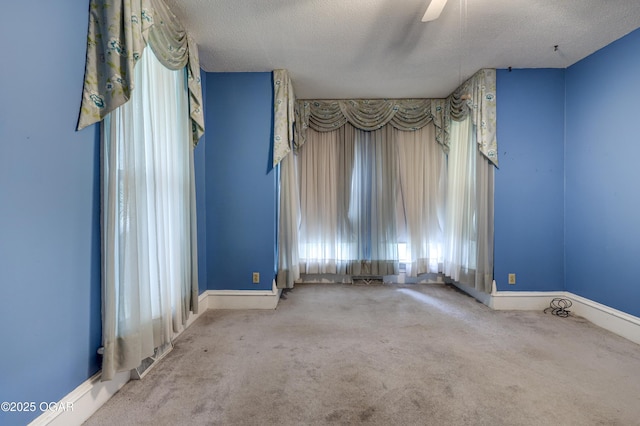 117 S 11th St, Sarcoxie, MO 64862 - spare room featuring plenty of natural light, carpet floors, a textured ceiling, and ceiling fan