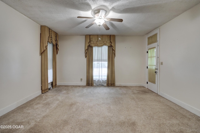 117 S 11th St, Sarcoxie, MO 64862 - carpeted spare room with ceiling fan, a textured ceiling, and healthy amount of natural light