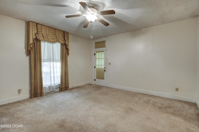 117 S 11th St, Sarcoxie, MO 64862 - spare room featuring a textured ceiling, ceiling fan, and light colored carpet