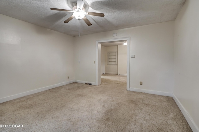 117 S 11th St, Sarcoxie, MO 64862 - spare room featuring a textured ceiling, light carpet, and ceiling fan