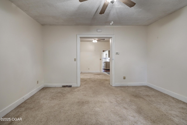 117 S 11th St, Sarcoxie, MO 64862 - spare room featuring ceiling fan, carpet floors, and a textured ceiling
