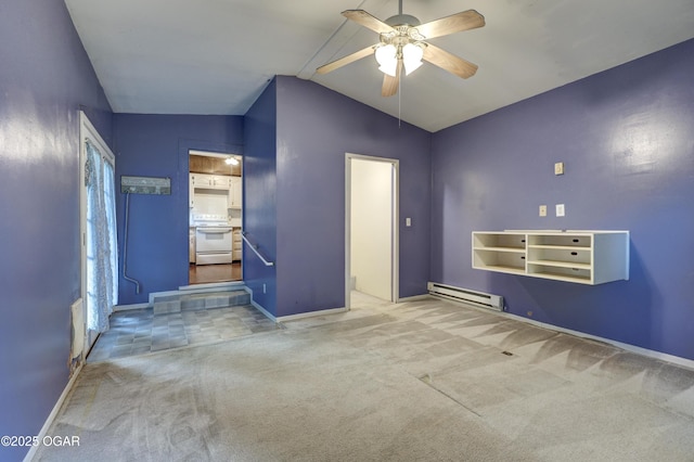 117 S 11th St, Sarcoxie, MO 64862 - spare room featuring baseboard heating, a ceiling fan, vaulted ceiling, and carpet