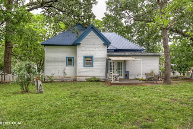 117 S 11th St, Sarcoxie, MO 64862 - back of house with french doors, a patio, and a metal roof