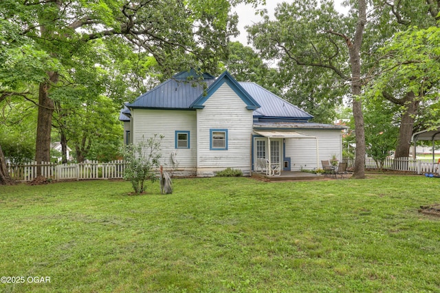 117 S 11th St, Sarcoxie, MO 64862 - rear view of property with a fenced backyard, a patio, a metal roof, and a detached carport