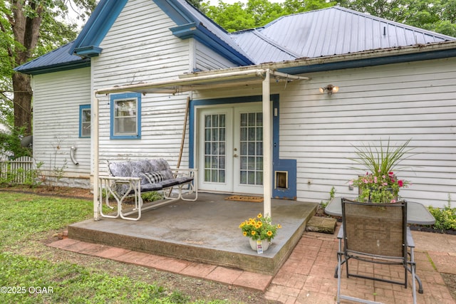 117 S 11th St, Sarcoxie, MO 64862 - rear view of property with french doors, a patio area, and a metal roof