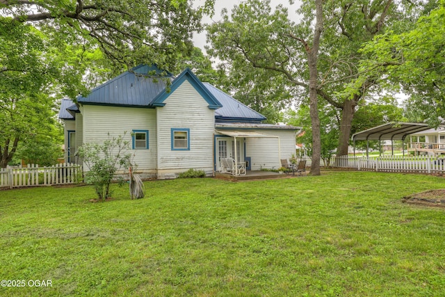 117 S 11th St, Sarcoxie, MO 64862 - back of property with a carport and a metal roof