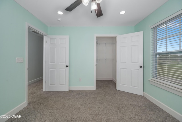 4610 W Amber Rd, Joplin, MO 64804 - unfurnished bedroom with carpet, a closet, a walk in closet, recessed lighting, and ceiling fan