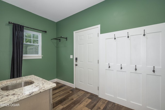4610 W Amber Rd, Joplin, MO 64804 - washroom with dark wood finished floors and baseboards