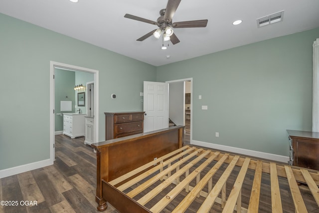 4610 W Amber Rd, Joplin, MO 64804 - unfurnished bedroom with dark wood-style floors, recessed lighting, ensuite bathroom, and a ceiling fan