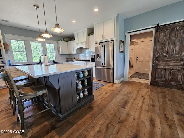 12673 Ibex Rd, Neosho, MO 64850 - kitchen featuring appliances with stainless steel finishes, white cabinetry, dark wood finished floors, open shelves, and light countertops
