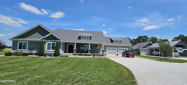 12673 Ibex Rd, Neosho, MO 64850 - craftsman-style house featuring board and batten siding, a porch, gravel driveway, and an attached garage