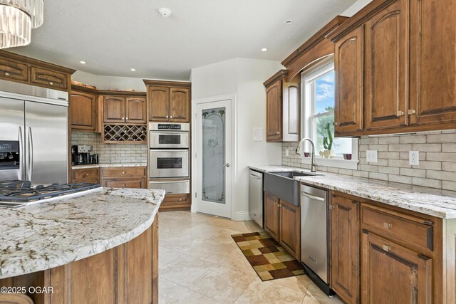 1641 Alexandra Dr, Carthage, MO 64836 - kitchen with stainless steel appliances, a warming drawer, backsplash, recessed lighting, and light stone counters