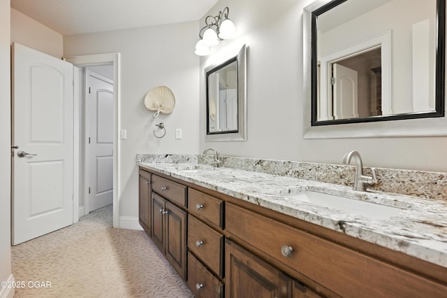 1641 Alexandra Dr, Carthage, MO 64836 - bathroom featuring double vanity and baseboards
