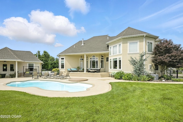 1641 Alexandra Dr, Carthage, MO 64836 - back of house with a patio, stucco siding, and roof with shingles