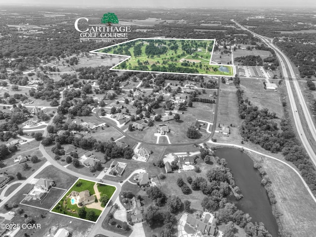 1641 Alexandra Dr, Carthage, MO 64836 - aerial overview of property's location with a nearby body of water and property parcel outlined