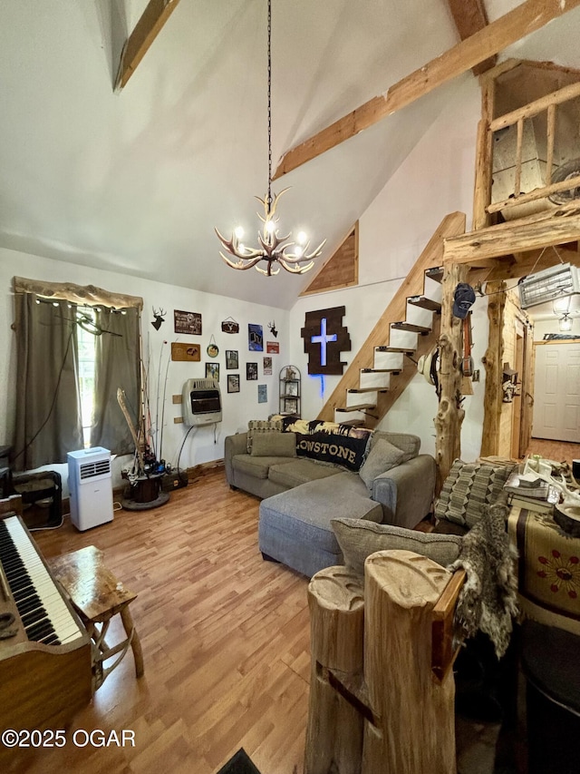 17568 Jordan Ln, Neosho, MO 64850 - living area with high vaulted ceiling, beamed ceiling, a chandelier, stairway, and wood finished floors