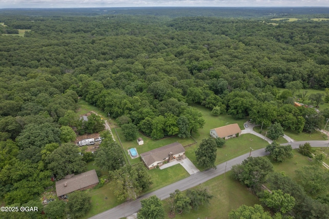 214 S Ozark Trl, Goodman, MO 64843 - aerial view of property and surrounding area with a heavily wooded area
