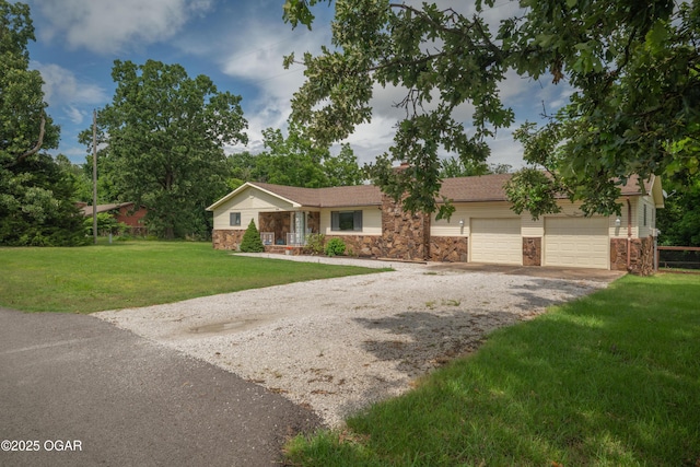 214 S Ozark Trl, Goodman, MO 64843 - ranch-style house with stone siding, driveway, a front lawn, and an attached garage