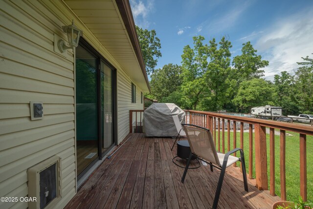 214 S Ozark Trl, Goodman, MO 64843 - deck with grilling area and a lawn