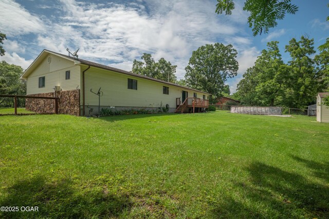 214 S Ozark Trl, Goodman, MO 64843 - view of yard with a deck