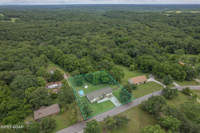 214 S Ozark Trl, Goodman, MO 64843 - view of property location featuring a forest and property parcel outlined