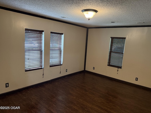 1310 Regan Ave, Carthage, MO 64836 - spare room with wood finished floors and a textured ceiling