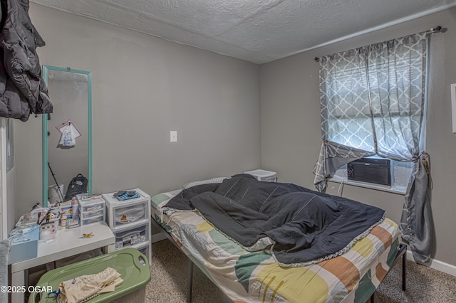 602 N Grand St, Pittsburg, KS 66762 - bedroom featuring carpet, cooling unit, and a textured ceiling